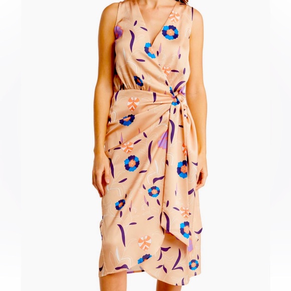 floral print elevates a sleeveless midi dress fashioned in a wrap silhouette - Picture 1 of 3